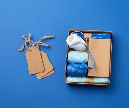 set for packing holiday gifts on a blue background, top view