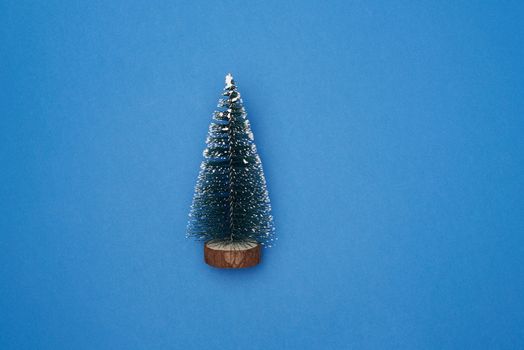 Christmas decor New Year tree on a blue background, top view