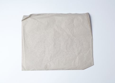 empty gray crumpled sheet of paper, full frame, close up