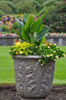 Decorative stone flower planter on lawn