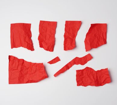 various blank pieces of red paper on white background, copy space