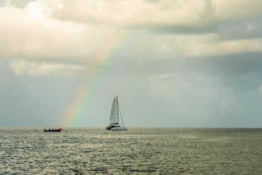 Catamaran at Rodney bay with rainbow in the backround, Saint Lucia, Caribbean sea