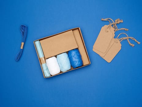 set for packing holiday gifts on a blue background, top view