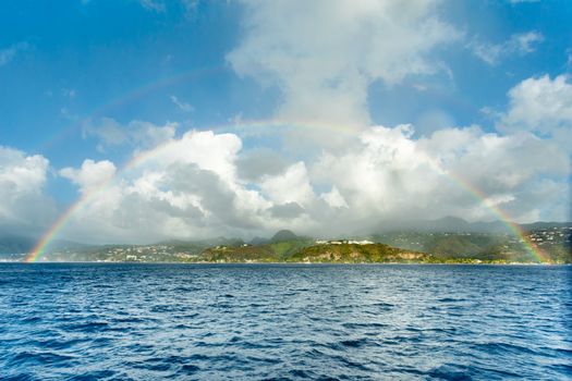 Double rainbow over the caribbean island view from the sea, Saint Pierre, Martinique,  French overseas department