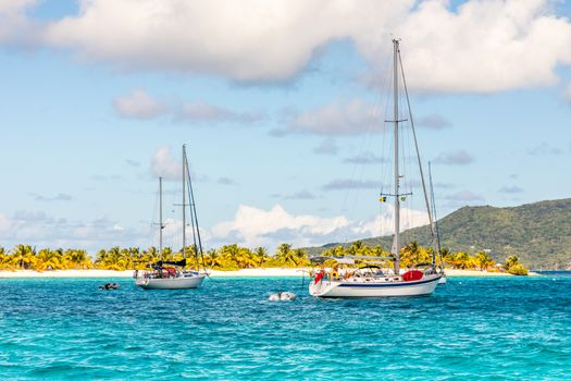 Turquoise sea and anchored yachts at Sandy beach island, near Carriacou island, Grenada, Caribbean sea