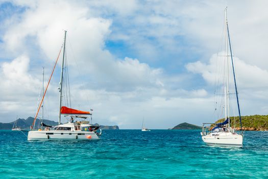 Turquoise sea and anchored yachts and catamarans, Tobago Cays, Saint Vincent and the Grenadines, Caribbean sea