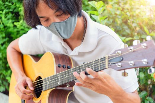 playing guitar in the park