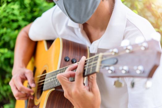 playing guitar in the park