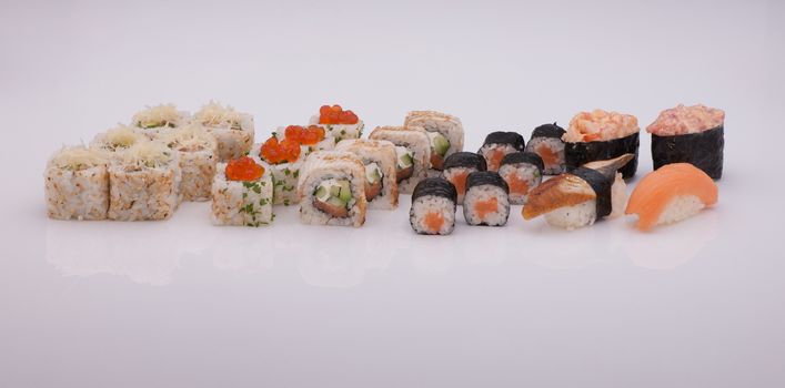 assortment of sushi on a white background