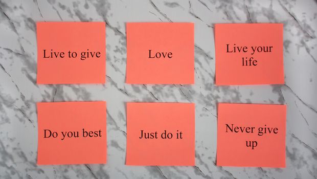 Motivational words on colored sheets of paper. Creativity and art. Study, education, work. Office, school, University. Stationery. Rainbow