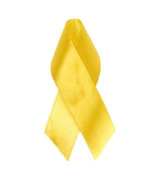 yellow silk ribbon loop on a white background. Sarcoma bone cancer awareness, top view