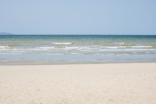 Beautiful beach with white sand and blue and clear sky background for travel and nature concept
