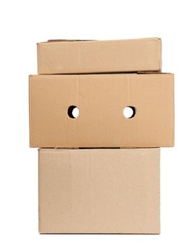 stack of closed cardboard brown paper boxes isolated on white background