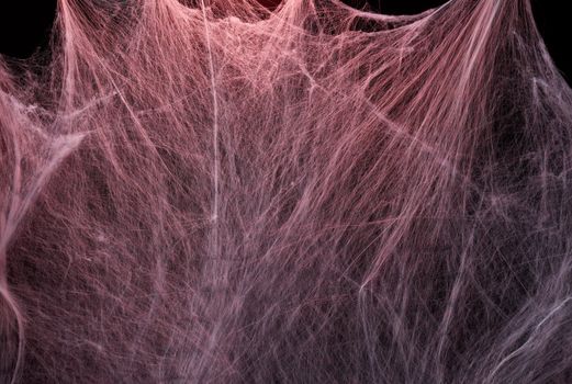 stretched white web with red backlight, background for the holiday Halloween, copy space