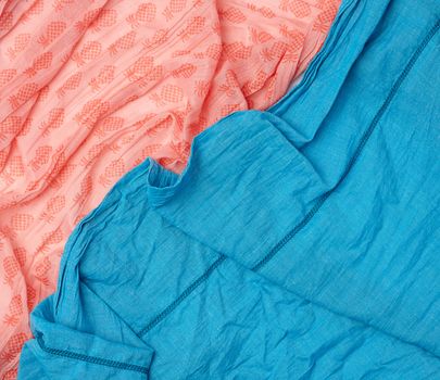 fragment of blue and pink cotton fabric, full frame, close up