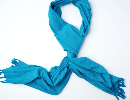 blue female scarf imitates tying around the neck on a white background, top view