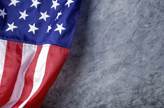 American flag on cement background with copy space