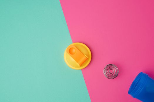 plastic blue shaker bottle with a yellow cap and an iron ball for sports people	