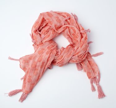 pink female scarf imitates tying around the neck on a white background, top view
