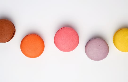 colorful baked macaron almond flour on a white background, flat lay
