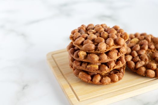Thai fried peanut cookies for asian dessert, food and eating concept