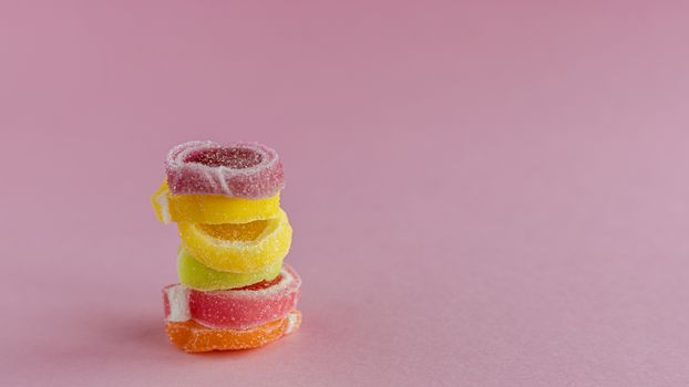 Colourful fruit Jelly candy on pink background for food and snack concept