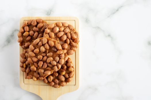 Thai fried peanut cookies for asian dessert, food and eating concept