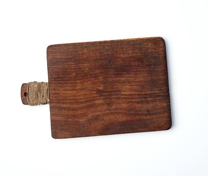 very old empty wooden rectangular cutting board, top view, white background