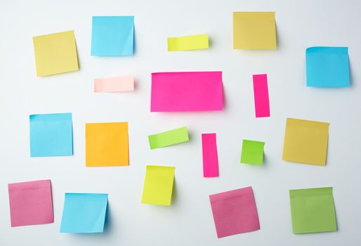 multicolored blank paper stickers of different sizes and shapes on a white background