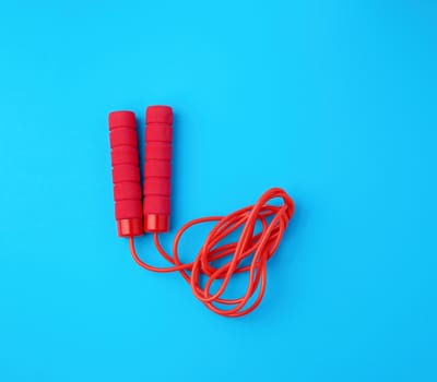 red rope for sports on a blue background, two neoprene handle