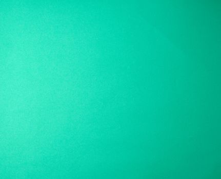green paper background from thick paper, full frame, close up