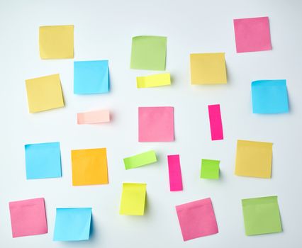 multicolored blank paper stickers of different sizes and shapes on a white background