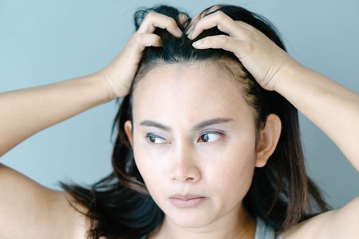 Woman serious hair loss problem for health care shampoo and beauty product concept, selective focus