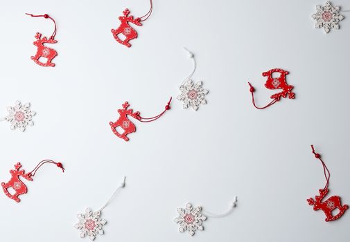 wooden carved Christmas decorations for the holiday tree on a white background