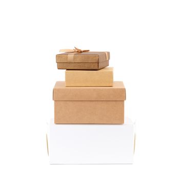 stack of closed various cardboard boxes on a white background, close up
