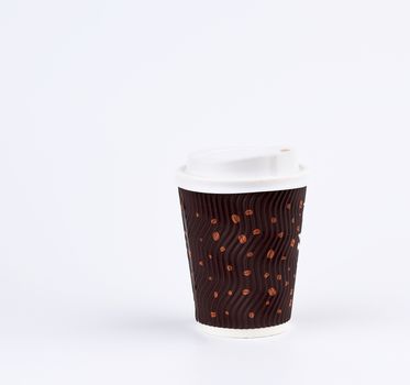 used brown paper cup with plastic cover for hot and cold drinks on a white background