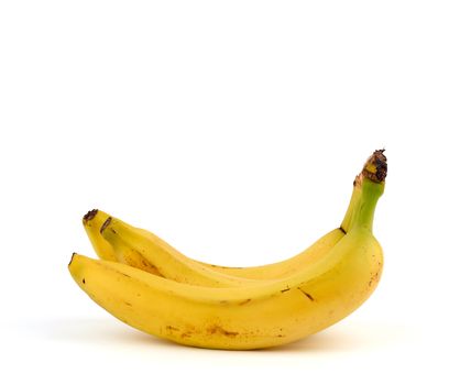 ripe yellow bananas in a peel on a white background, close up