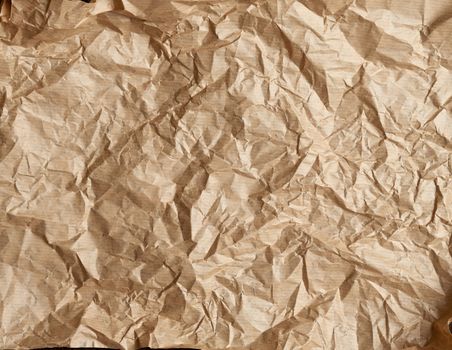 crumpled brown parchment baking paper, full frame, close up