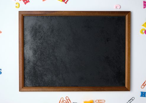 empty black chalk frame, white  background, back to school 