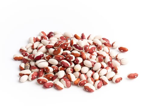 bunch of raw white-red beans on a white background, close up