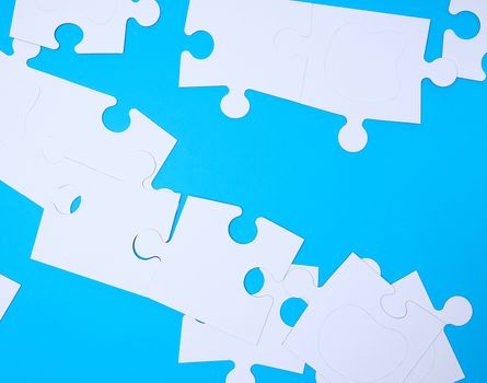 empty white big puzzles on a blue background. Concept in business