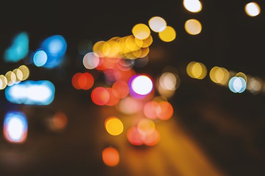 Abstract background, bokeh light on the traffic road at night