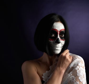 woman with black short hair in white makeup Sugar head to the day of the dead, black background