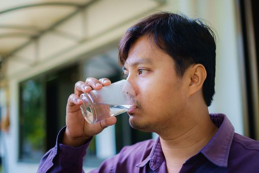 A man drinking fresh water