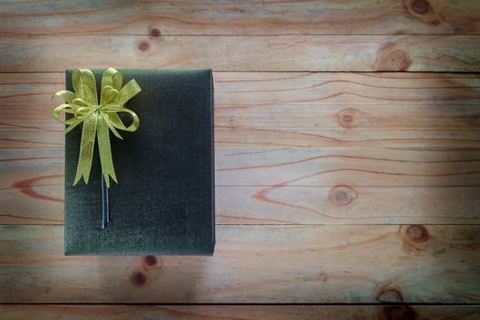 Gift box on wooden table