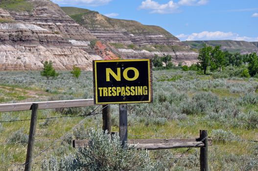 No trespassing sign on ranch fence