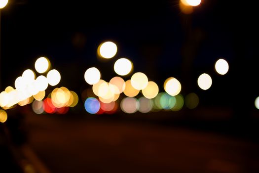 Abstract background, bokeh light on the traffic road at night