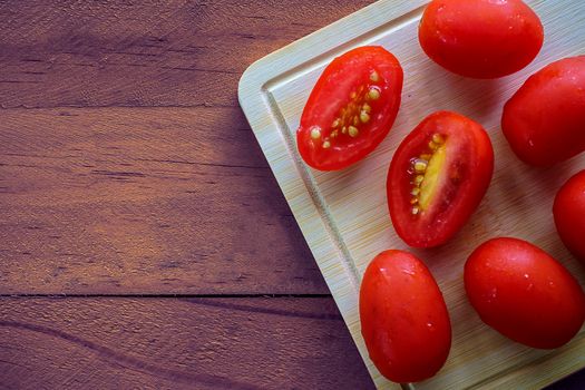 Fresh red cherry tomato on wooden table