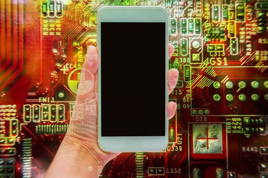 Double exposure of hand holding mobile smartphone and electronic circuit board, communication technology concept
