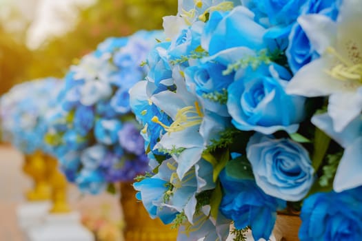 Selective focus of blue bouquet of artificial flowers